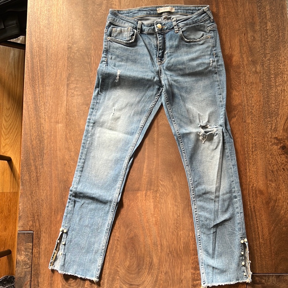 Zara ripped jeans with pearl details.